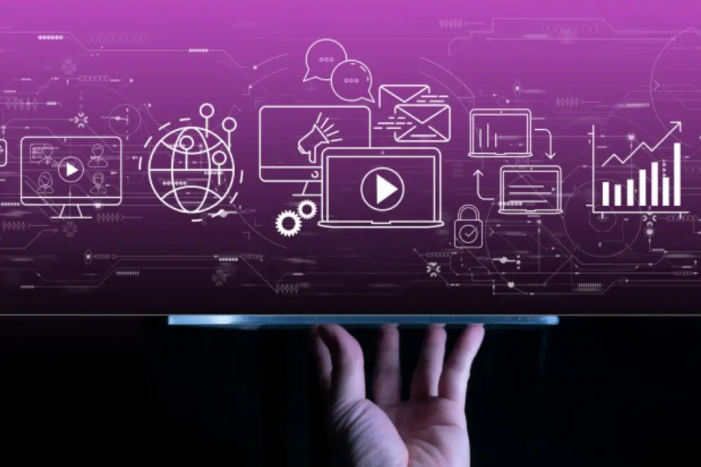 digital-marketing hand holding tablet with computer display, megaphone, graphs, and other digital marketing terms.