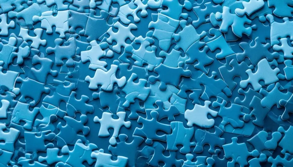 local-iq-alignment a bunch of random blue puzzle pieces mixed together.