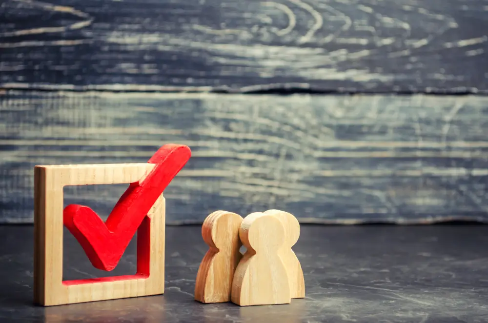 digital-expectations three wooden avtars next to a block with a red checkmark
